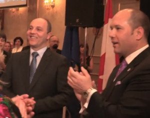 Andriy Parubiy (L) applauds Canadian Minister of Citizenship and Immigration Chris Alexander speaking to pro-Ukraine war fundraising event in Toronto Feb 22, 2015