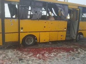 Bus hit by shells at town of Volnovakha, Ukraine on Jan 13, 2015, image via RT