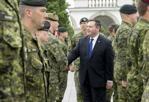 Canadian Defense Minister Jason Kenney greeting Canadian soldiers in Poland June 9, 2015 (DND photo, Cpl Precious Carandang)