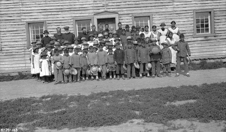 officials_and_schoolchildren_outside_providence_mission_indian_residential_school_fort_providence_northwest_territories.pg_